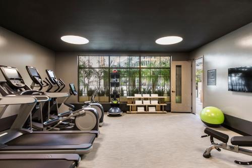 a gym with treadmills and elliptical machines at Kimpton La Peer Hotel West Hollywood, an IHG Hotel in Los Angeles
