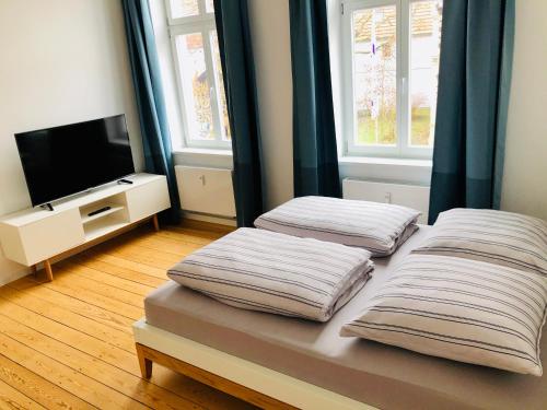 Kama o mga kama sa kuwarto sa Ferienapartment Warnemünde 2