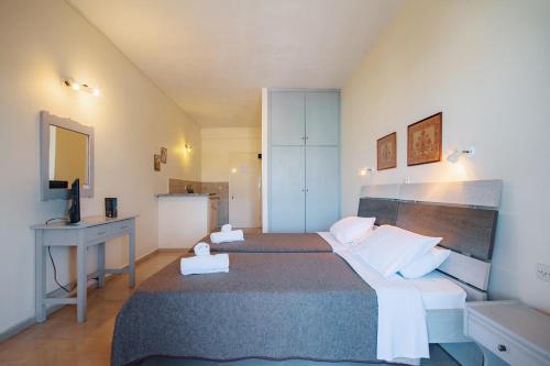 מיטה או מיטות בחדר ב-Villa Rosa Apartments