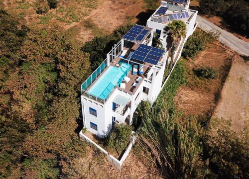 an aerial view of a house with a swimming pool at Anna Plakias Apartments in Plakias