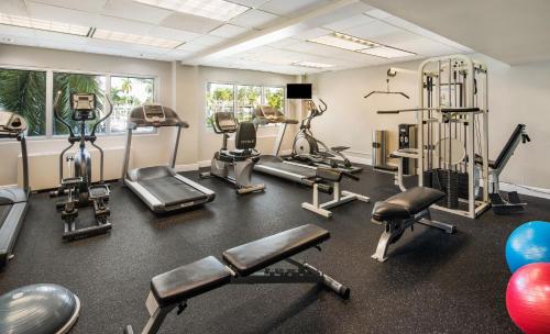 a gym with treadmills and machines in a room at Holiday Inn Hotel Port of Miami-Downtown by IHG in Miami