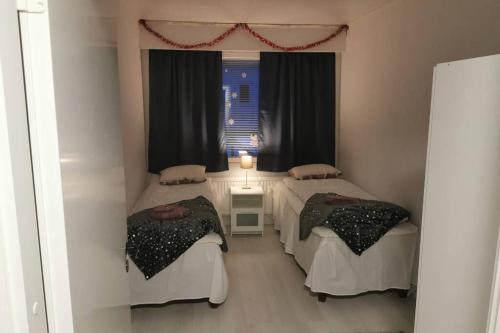 Ένα ή περισσότερα κρεβάτια σε δωμάτιο στο Villa Arctic Passion