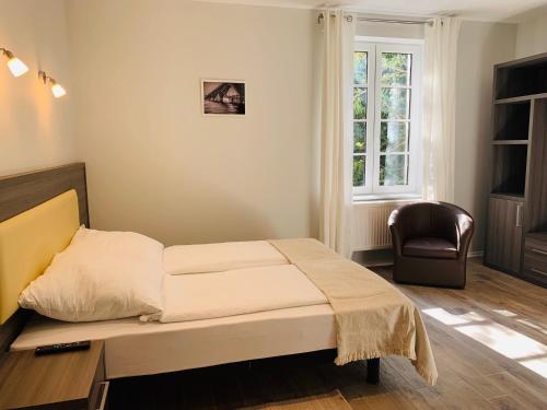 Postel nebo postele na pokoji v ubytování Villa Luttwitz