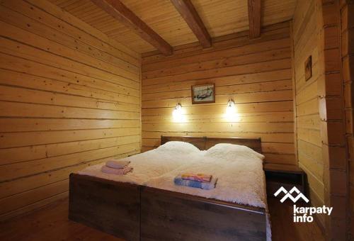 a room with a bed in a sauna at Вілла Лісова комфорт in Skhidnitsa