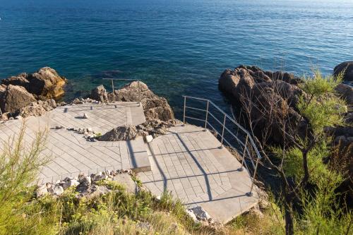 a set of stairs leading down to the ocean at Marie in Krk