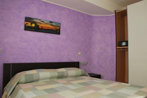 Ένα ή περισσότερα κρεβάτια σε δωμάτιο στο Case Vacanze Anni 20