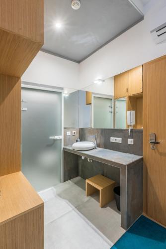 a bathroom with a sink and a toilet at TCZ Woźna in Poznań