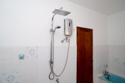 a shower with a shower head in a bathroom at Mount Marina Villas 12 in Galle