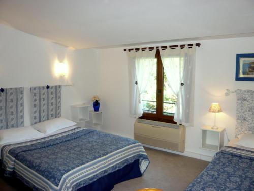 Ένα ή περισσότερα κρεβάτια σε δωμάτιο στο Hotel Mistral
