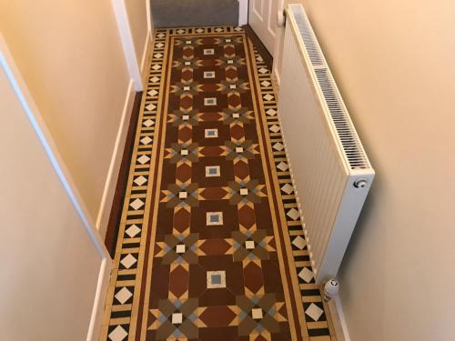 a stairway with a tile floor in a hallway at Cosy Vibes Central Cardiff House in Cardiff