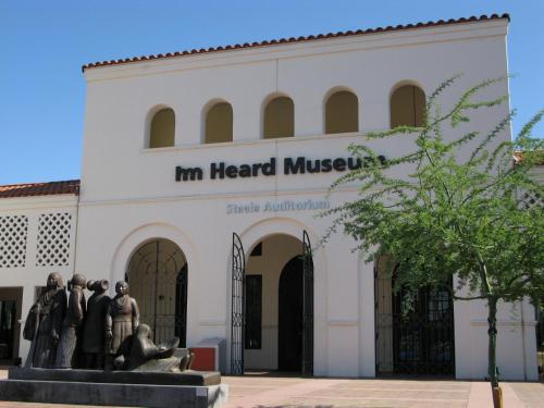 a building with a statue in front of it at Holiday Inn Express & Suites - Phoenix - Airport North by IHG in Phoenix