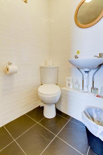 a bathroom with a toilet and a sink at New Brooklyn in Blackpool