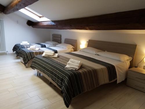 
A bed or beds in a room at Centro Storico Suites
