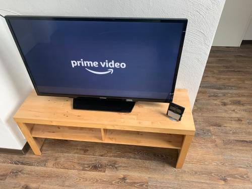 a tv on a wooden stand with a tv on it at DIE Mansarde ! in Saarbrücken