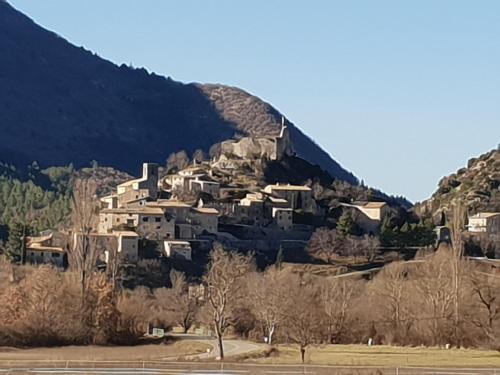a village on the side of a mountain at Mas de Reilhanette in Montbrun-les-Bains
