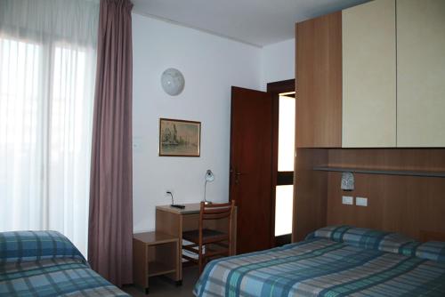 Posteľ alebo postele v izbe v ubytovaní Hotel Ondina