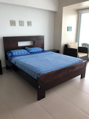 Departamentos frente al mar en Resort Playa Azul-Tonsupaにあるベッド