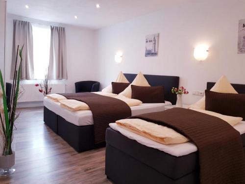 Postel nebo postele na pokoji v ubytování Füssen Apartments - Center Apartments
