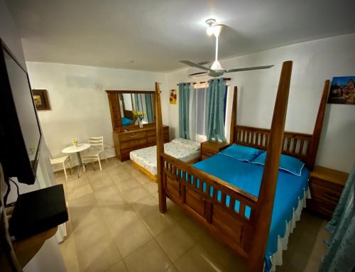 Postel nebo postele na pokoji v ubytování El Malecon B&B Hotel