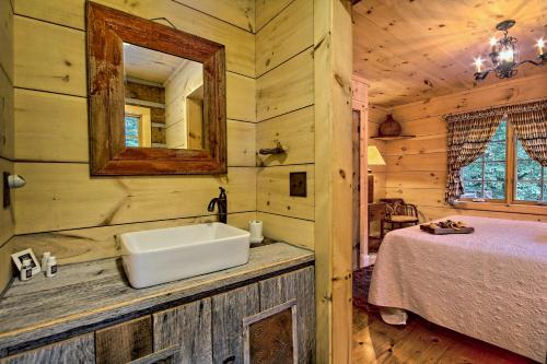 a bathroom with a sink in a log cabin at Lake Rabun Hotel in Lakemont