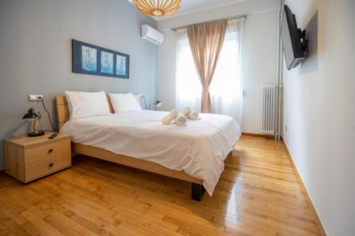 Ένα ή περισσότερα κρεβάτια σε δωμάτιο στο Leon Cozy Apartment