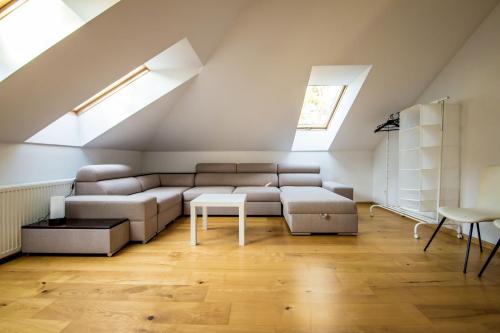 a living room with a couch and a window at Dom w lesie in Łask