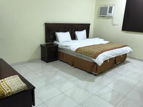 מיטה או מיטות בחדר ב-Etlalet Al-Sharm Apartments