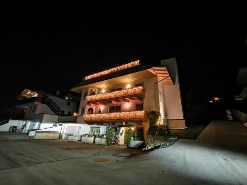 a large building at night with its lights on at Ferienlandhaus Höfer in Fulpmes