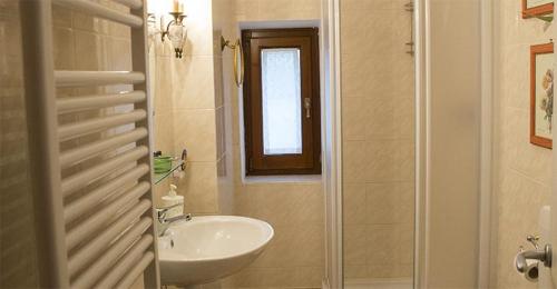 a bathroom with a sink and a toilet and a shower at Il Mugello B&B in Vicchio