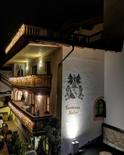 a building with a sign that reads campania hotel at Ferienlandhaus Höfer in Fulpmes