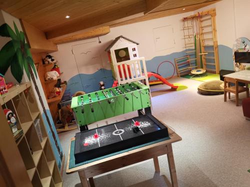 a room with a toy house on a table at Ferienlandhaus Höfer in Fulpmes
