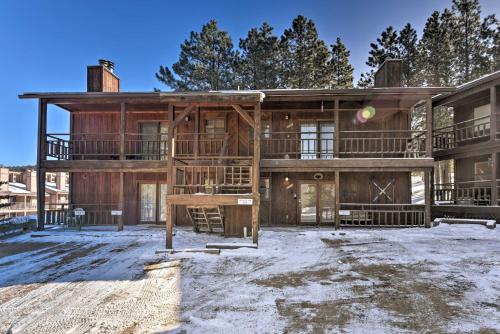 an exterior view of a large wooden house at Cozy Angel Fire Condo Less Than Half Mi to Resort! in Angel Fire