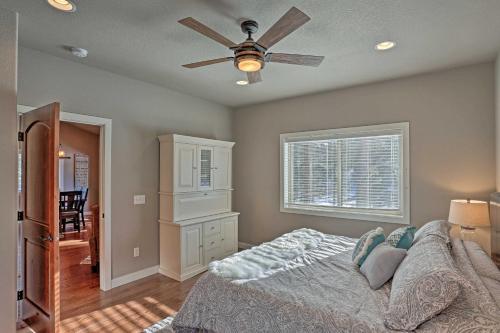 a bedroom with a bed and a ceiling fan at Lead Family Home with Hot Tub, 2 Mi to Deer Mountain in Lead