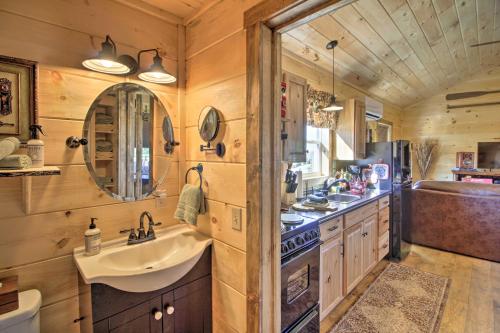 a bathroom with a sink and a stove and a sink at Valley View Cabin Near Branson and Table Rock Lake in Omaha