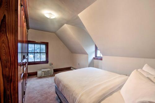 a bedroom with a white bed and a window at 2 Mi to Reading Pagoda Spacious Home with Deck! in Reading