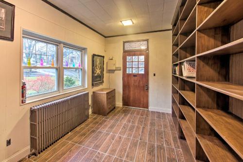 a room with a hallway with wooden shelves and a door at 2 Mi to Reading Pagoda Spacious Home with Deck! in Reading