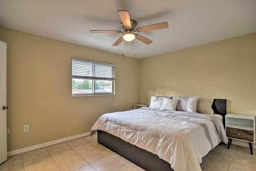a bedroom with a bed and a ceiling fan at Cozy Indian Rocks Beach Condo - Steps to Beach! in Clearwater Beach