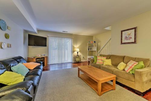 a living room with a couch and a coffee table at Family-Friendly Wildwood Townhome about 3 Mi to Beach in Wildwood