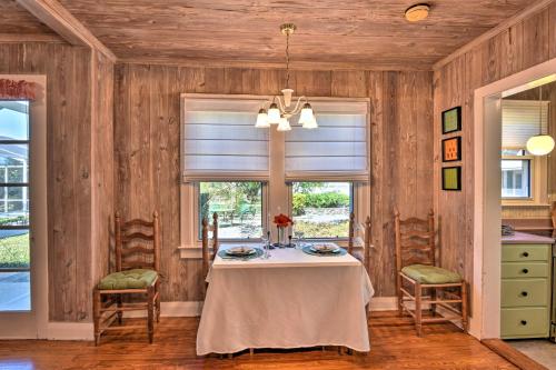 a dining room with a table and a window at Cottage with Private Pool - Walk to Lake Wales! in Lake Wales
