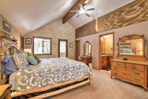 a bedroom with a bed and a dresser and a mirror at Cozy Home with Mountain Views Near Ouray Hot Springs in Ouray
