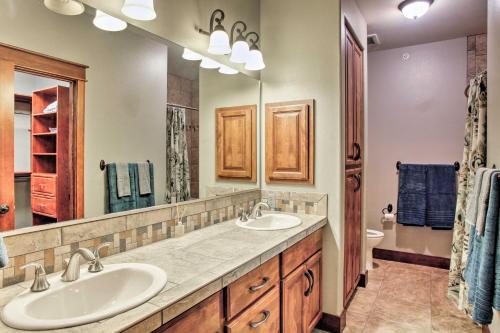 a bathroom with two sinks and a large mirror at Coeur dAlene Condo - 2 Mi to Beach and Lake! in Coeur d'Alene