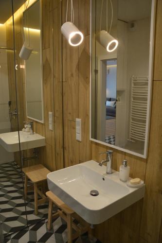 A bathroom at Last Floor Apartment - Krakow City Center close to Old Town