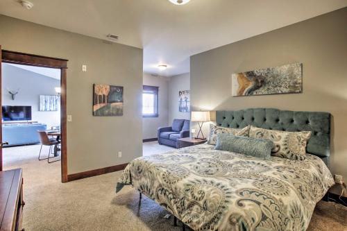 a bedroom with a bed and a living room at Coeur dAlene Condo - 2 Mi to Beach and Lake! in Coeur d'Alene