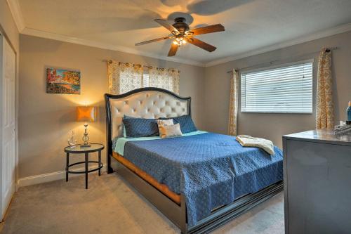 a bedroom with a bed and a ceiling fan at Condo-Walk to Daytona Beach, 6 Mi to Speedway in Daytona Beach