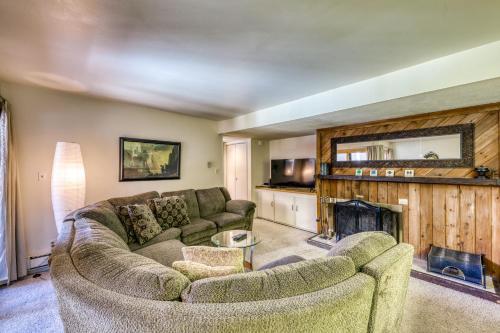 a living room with two couches and a fireplace at Wild Irishman 1080 in Dillon