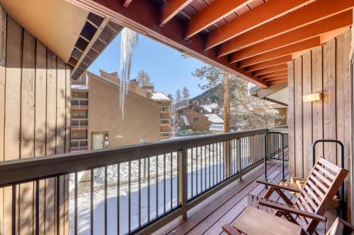 a balcony with a chair and a view of a pool at Wild Irishman 1080 in Dillon
