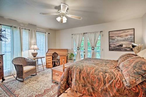 a bedroom with a bed and a ceiling fan at Riverfront Martindale House with 2 Covered Decks in Martindale