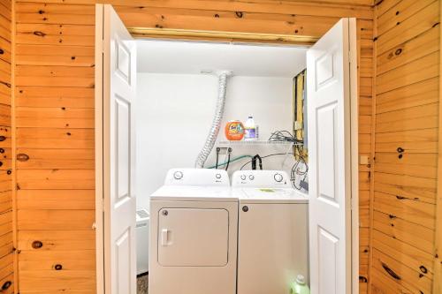 a small laundry room with a washer and dryer at Lake Placid Home about 9 Mi to Whiteface Mtn! in Lake Placid