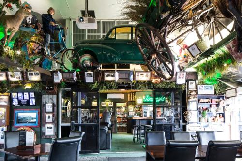 a restaurant with a car hanging from the ceiling at Pavilions Hotel in Christchurch