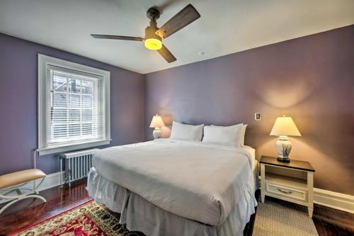 a bedroom with a large bed with a ceiling fan at Cozy Reading Retreat with Comm Patio by The Pagoda! in Reading